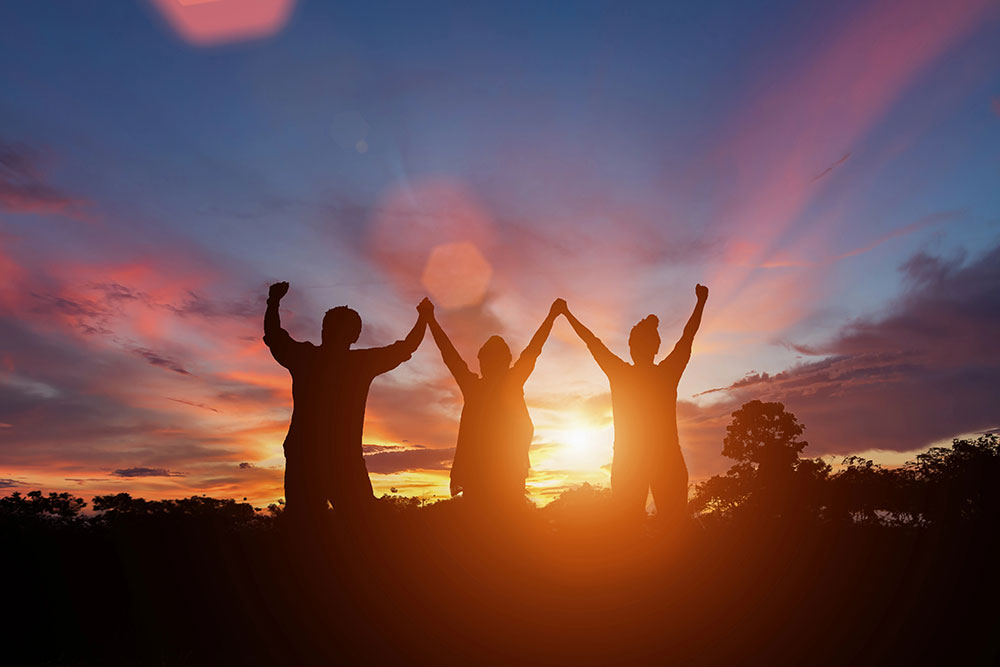 Happy family in sunset